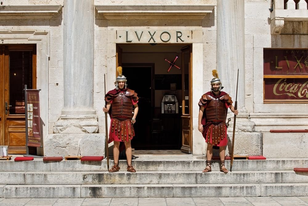 Restaurant Lvxor entrance with Roman centurions on Peristyle Square